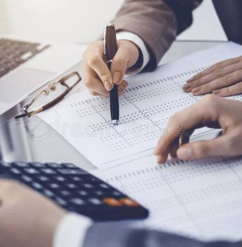 two-female-accountants-counting-calculator-income-tax-form-completion-hands-close-up-business-audit-concept-two-female-147374320 two-female-accountants-counting-calculator-income-tax-form-completion-hands-close-up-business-audit-concept-two-female-147374320